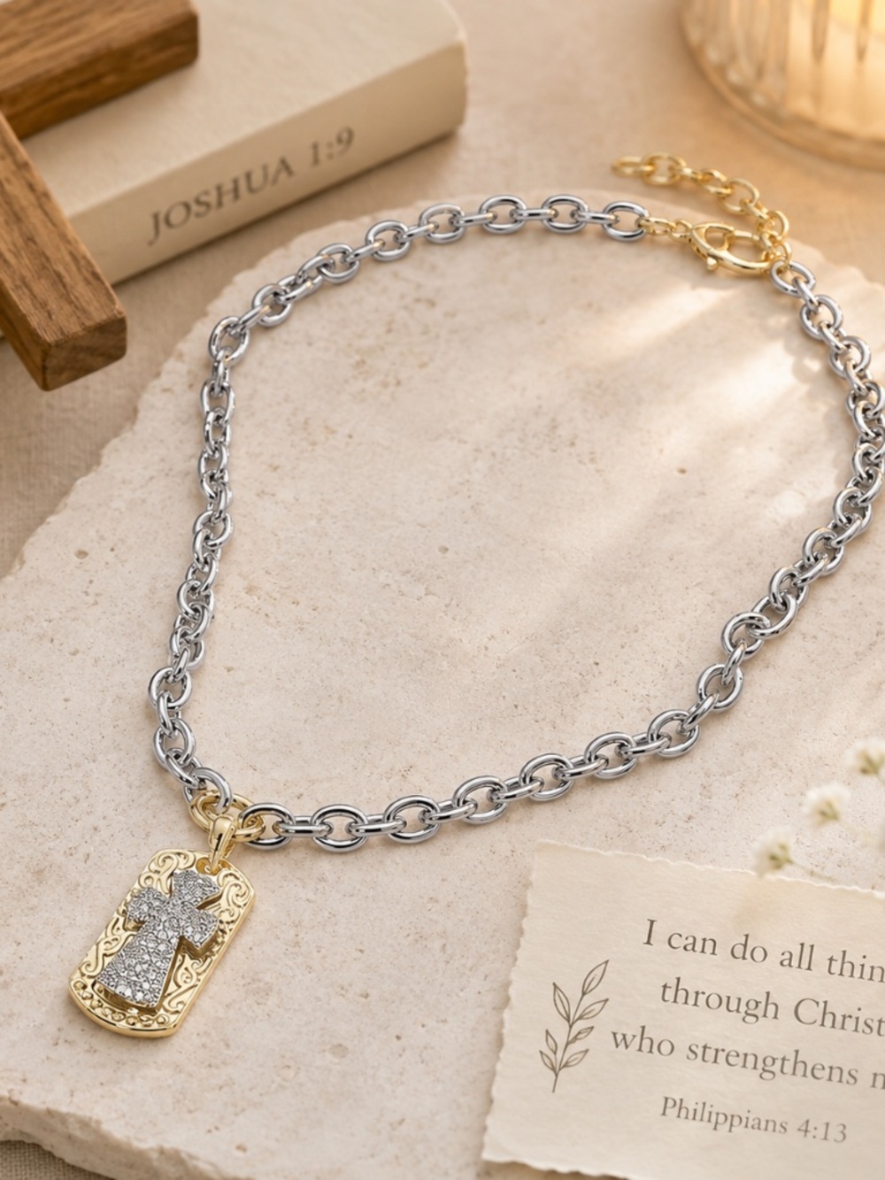 Chunky silver link necklace with a silver and gold cross pendant